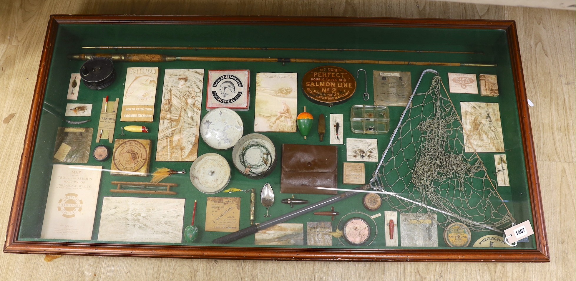 A framed fishing montage 66 x 132cm